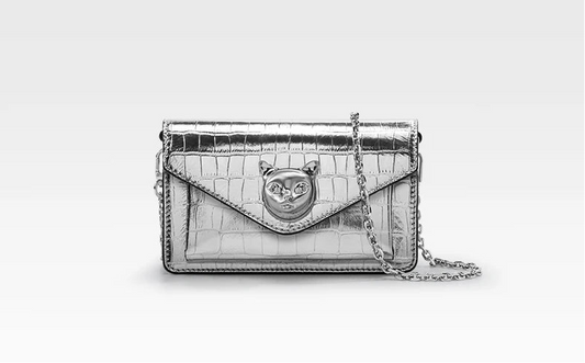 A silver BAFELLI leather mini party crossbody bag with a chain strap, displayed against a white background.