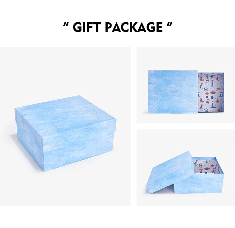 Gift package with a blue marble-patterned box and a smaller box with a colorful pattern inside.