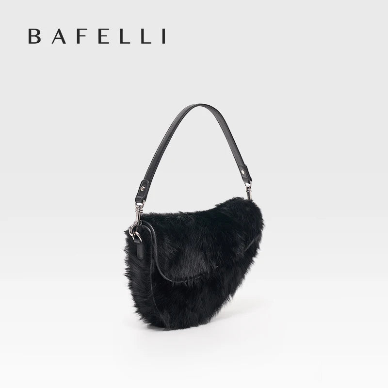 Black fur handbag with a shoulder strap on a white background